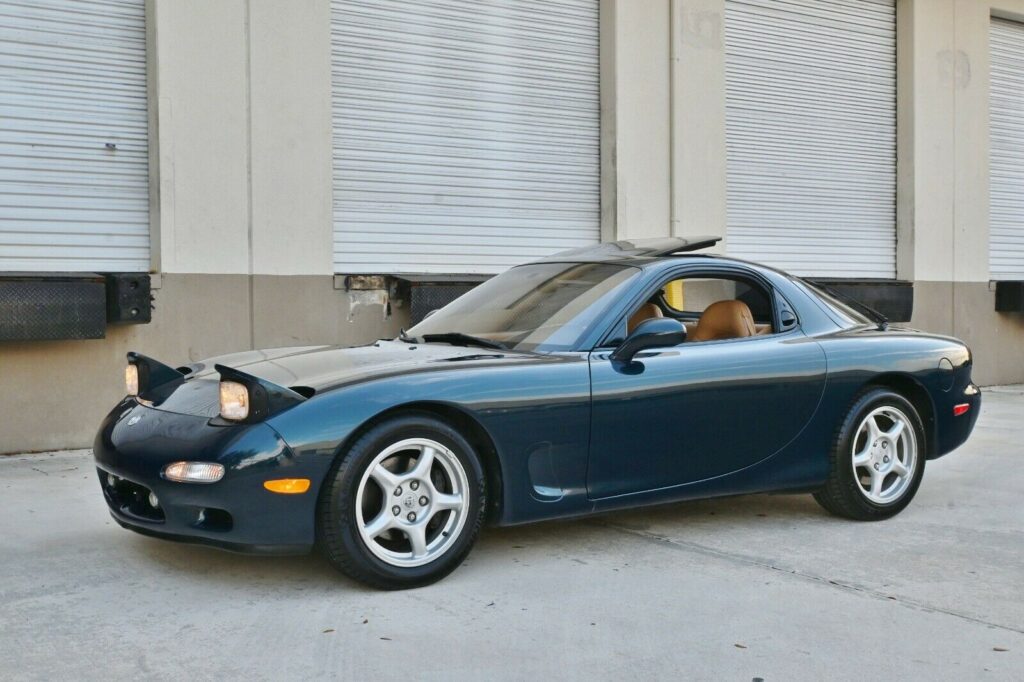 Front angle view of driver's side of Montego Blue 1993 Mazda RX-7 Touring 