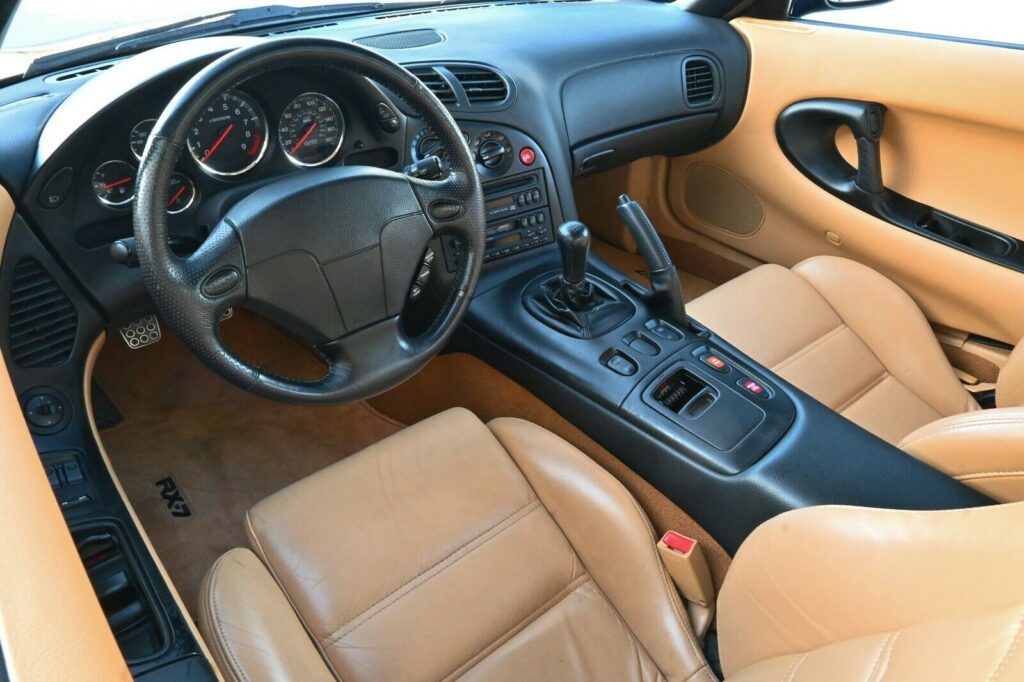 Tan leather cabin of Montego Blue 1993 Mazda RX-7 Touring 