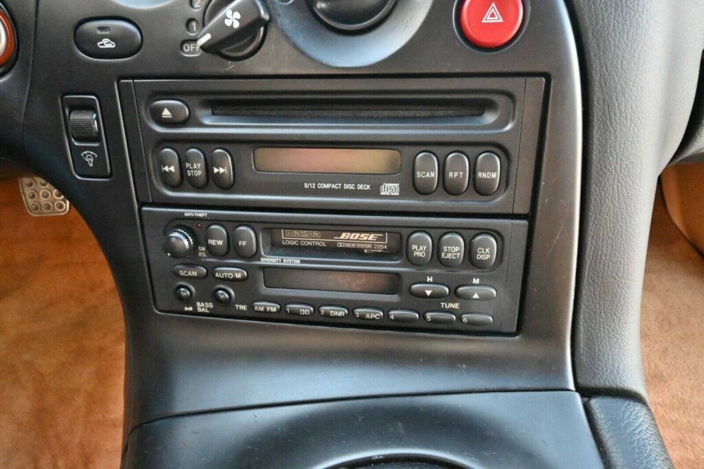 Factory Bose stereo head unit in Montego Blue 1993 Mazda RX-7 Touring 