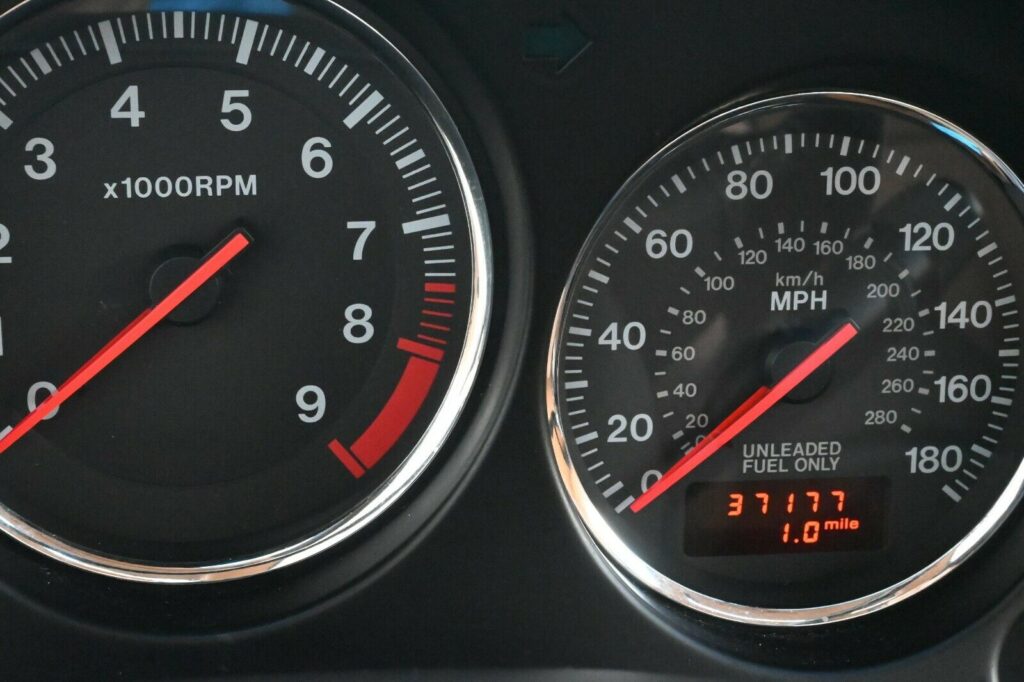 Gauges and odometer of low-mileage Montego Blue 1993 Mazda RX-7 Touring 