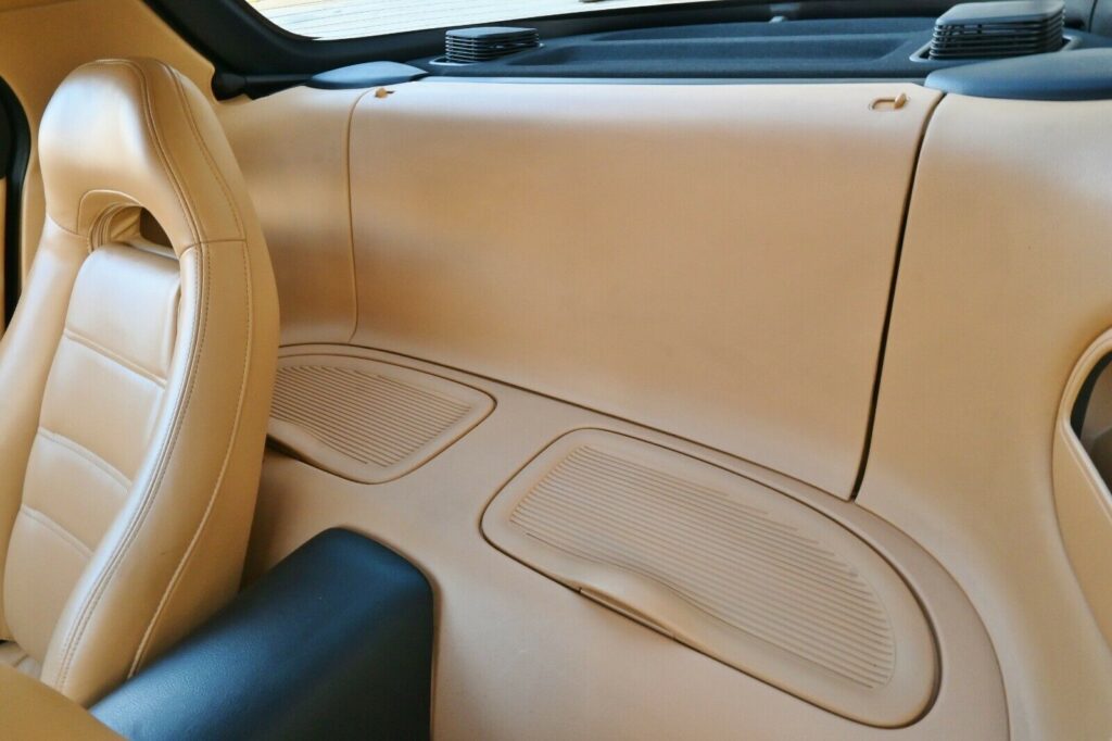 Rear storage compartments in Montego Blue 1993 Mazda RX-7 Touring with tan interior