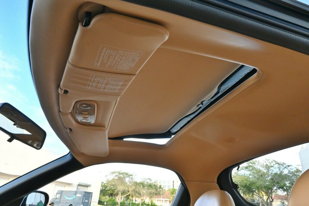 Tan headliner and sunroof bottom of Montego Blue 1993 Mazda RX-7 Touring 