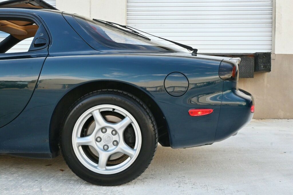 Rear side of Montego Blue 1993 Mazda RX-7 Touring 